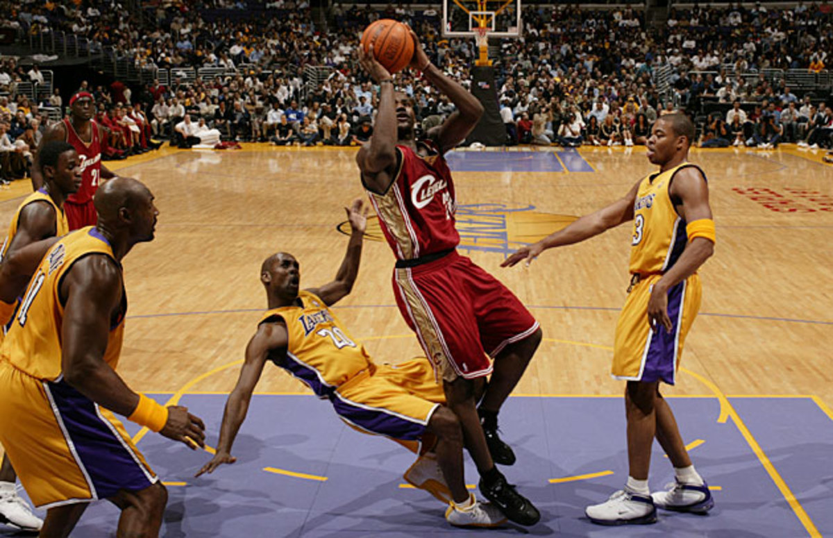 He may be young, but at 6'8", 240 pounds, LeBron James can hold his own in the paint with his elders.